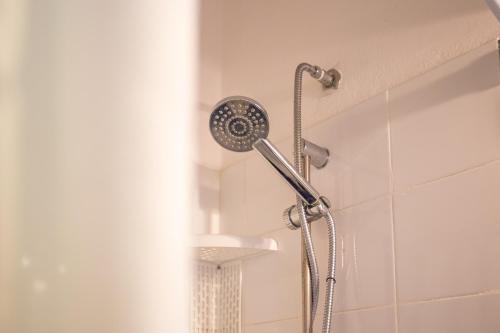 a shower with a shower head in a bathroom at Casa Carlotta in Costa Paradiso in Costa Paradiso