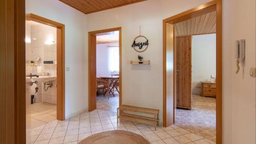 a hallway with a kitchen and a dining room at Springhansenhof in Oppenau