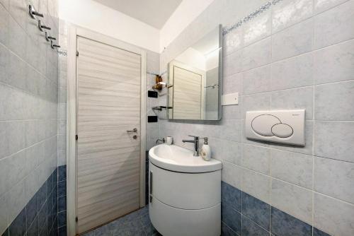 a bathroom with a toilet and a sink at Appartamento Bucaneve - Padola in Padola