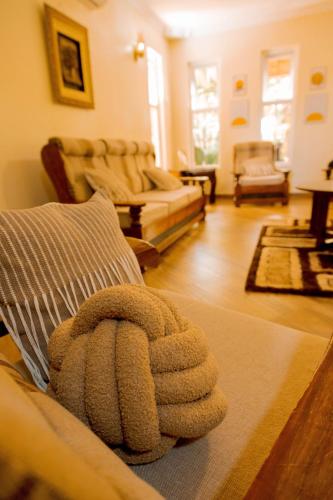 a living room with a pile of pillows at Rhovee Homes in Moshi
