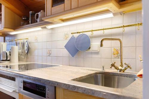 a kitchen with a sink and a counter top at Mayr Apartments Fünf in Plaus