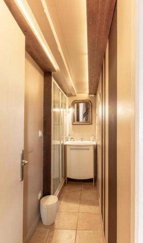 a bathroom with a toilet and a sink at Chalet Arclosan - Saint-Ferréol in Saint-Ferréol
