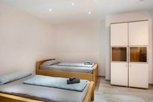 a room with two beds and a closet at Haus Schliengen in Schliengen