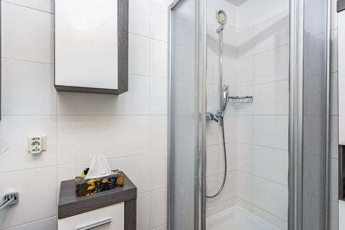a shower with a glass door in a bathroom at The view 2 in Bad Reichenhall