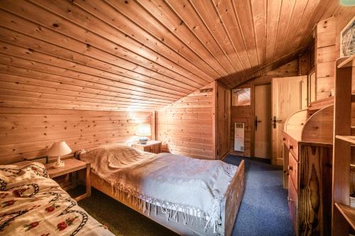 Llit o llits en una habitació de La Rissole - Chalet familial