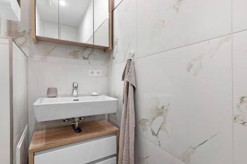 a bathroom with a sink and a mirror at Breisgau Lofts - Nähe Europapark in Herbolzheim