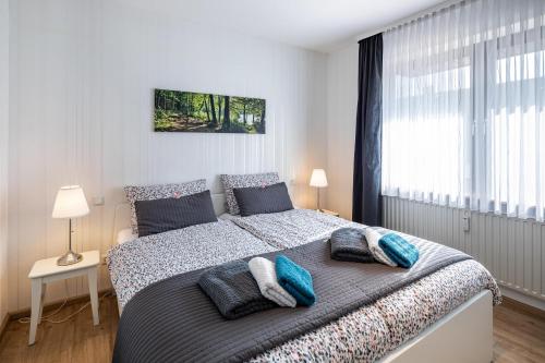 a bedroom with a large bed with pillows on it at Fewo Kirchheim in Kirchheim