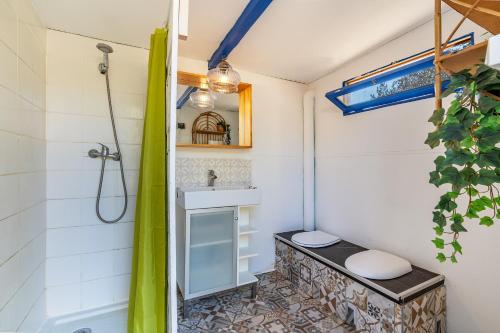 a bathroom with a shower and a sink and a toilet at Eco Yurta Lanjarón in Lanjarón