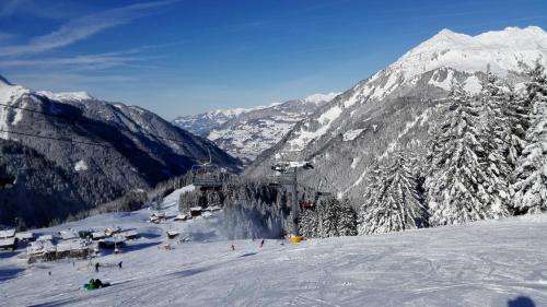 a ski lift on a snow covered mountain at Aktiv-Ferienwohnungen Montafon in Sankt Gallenkirch