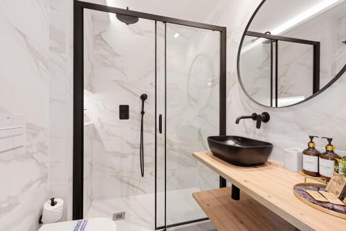 a bathroom with a sink and a shower at Manuela's whim in Málaga