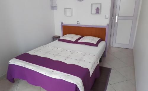 Llit o llits en una habitació de La Maison Bleue
