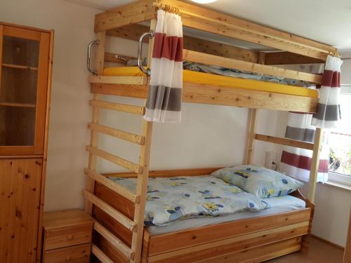 a bunk bed in a room with a bunk bed in a house at Bodensee-Landurlaub in Deggenhausertal