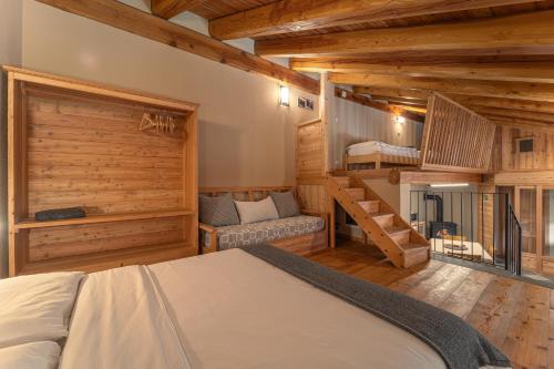 a bedroom with a bed and a bunk room at Civico 6 in Marmora