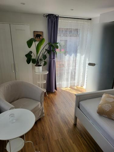 a living room with a couch and a table at Pension Linde in Höchenschwand