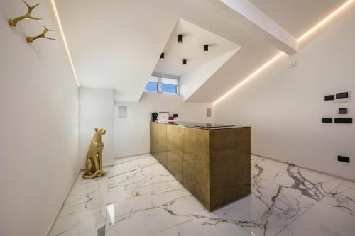 a room with white walls and a marble floor at App 301 Palazzo Cavour in Bolzano