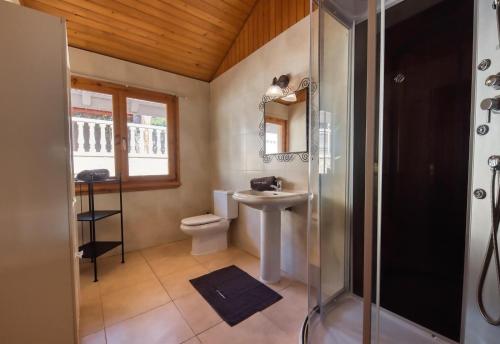 a bathroom with a toilet and a sink and a shower at Costacabana - Villa Primadonna in Lloret de Mar