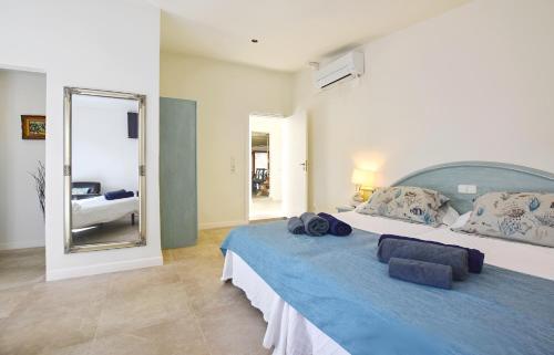 a bedroom with a large bed with a large mirror at Collet De Manacor in Manacor