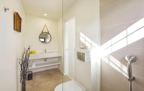 a bathroom with a glass shower stall and a sink at Collet De Manacor in Manacor