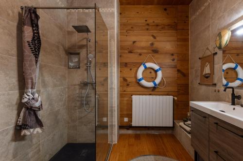 a bathroom with a shower and a sink at La Voûte Des Oliviers in Bessas