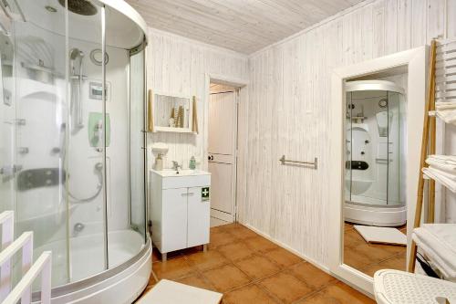 a bathroom with a shower and a sink at Sunset Cliffs By Slice Of Heaven in Ribeira Brava