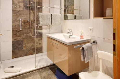 a bathroom with a sink and a shower at Ferienhaus Schwörer in Feldberg