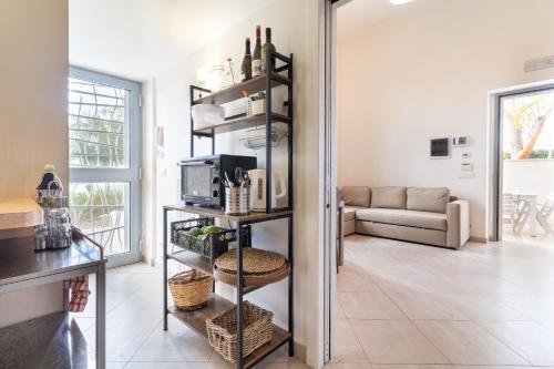 a living room with a shelf with a microwave at Water Run in Bari