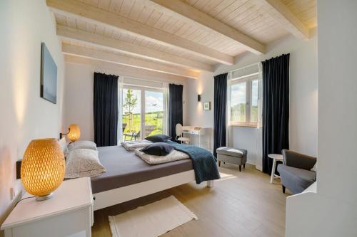 a bedroom with a large bed and a window at Waldwasserhaus Leisel in Leisel