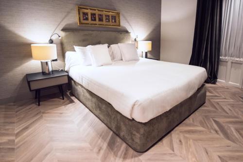 Palacio Salvetti Suitesにあるベッド