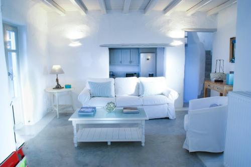 a living room with a white couch and a table at House with private pool in Naousa