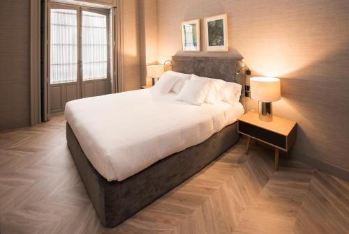 Palacio Salvetti Suitesにあるベッド
