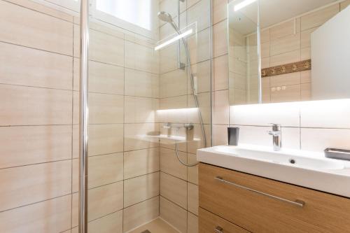 a bathroom with a sink and a shower at Villa de la brune in Bormes-les-Mimosas