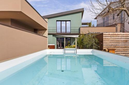 a swimming pool in the backyard of a house at Isola Degli Angeli in Reggello