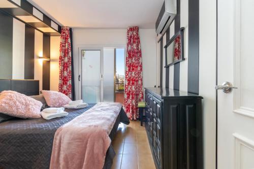 a bedroom with a bed and a bench in it at Salines in L'Estartit