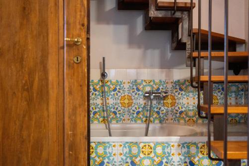 a bathroom with a sink in a room at Palazzo Cofani in Arezzo