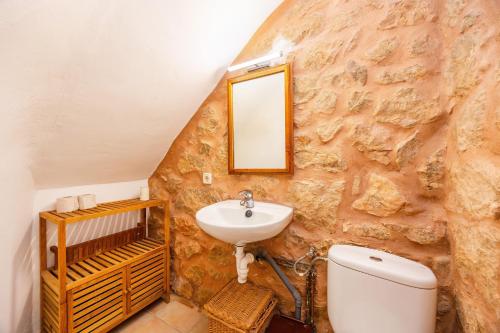 a bathroom with a sink and a toilet at Cal Rei in Inca