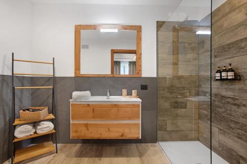 a bathroom with a sink and a shower at La Douce Pomme in Saint-Pierre