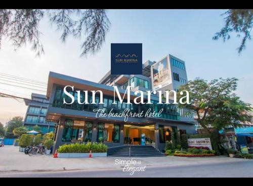 a building with a sign on the front of it at Sun Marina Cha-Am in Cha Am