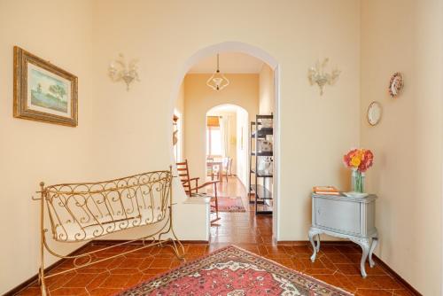 a living room with a bed and a table at Kina House in Marsala