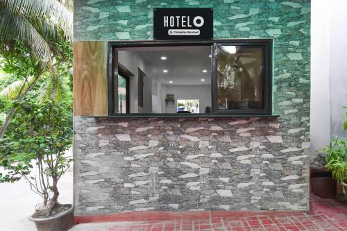 a mirror on the side of a building at Hotel O New Alipore in Kolkata