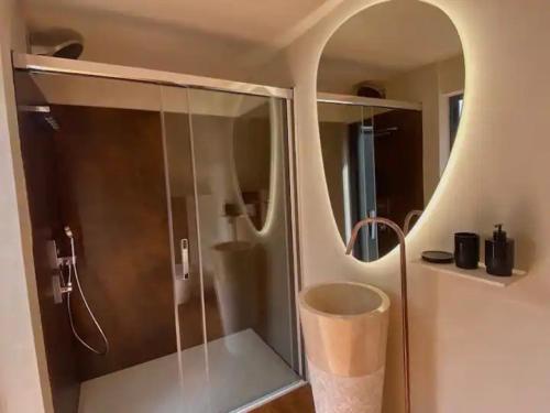 a bathroom with a shower with a glass door at La Saint Pabu'lle in Pléneuf-Val-André