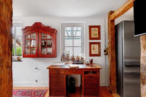 a kitchen with a counter and a refrigerator at Ruhige Auszeit im Taunus, Idstein in Idstein