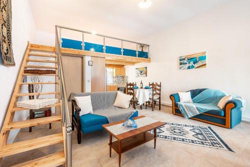a living room with a bunk bed and a couch at Beach Pearl in Lachania