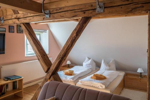 a room with two beds in a attic at Ferienwohnung Am Heideborn in Großschönau