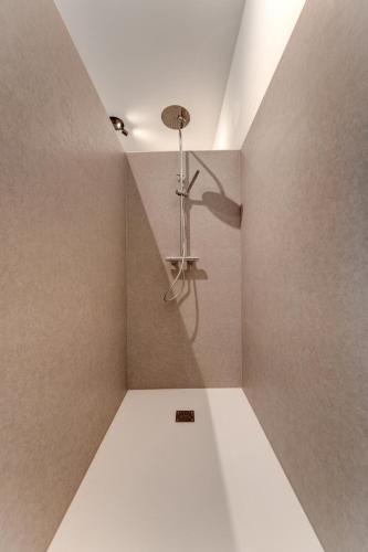 a shower in a room with a ceiling at Außergewöhnliches Loft Senftenbach in Senftenbach
