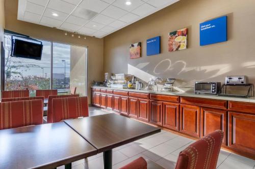 a fast food restaurant with a table and chairs at Comfort Inn & Suites Seattle North in Seattle
