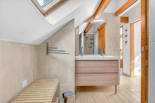 a bathroom with a sink and a mirror at Chalet Ma Bonne Etoile in Les Prats