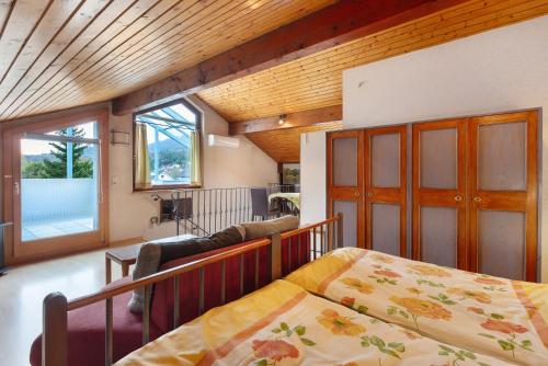 a bedroom with a bed and a living room at Haus Koch in Bad Säckingen