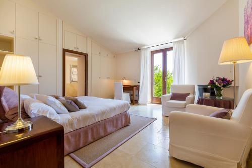 a large living room with a bed and a couch at Finca Son Pol in Andratx