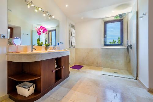 a bathroom with a large sink and a shower at Finca Son Pol in Andratx