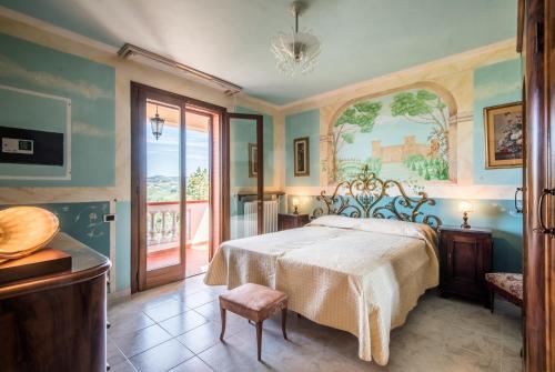 a bedroom with a bed and a large window at Villa Vanna - Certaldo in Vico dʼElsa